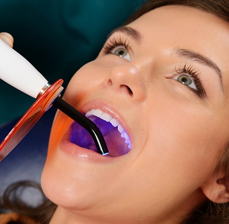 A woman getting cosmetic dental bonding