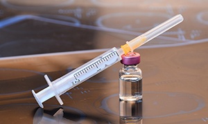 Bottle of BOTOX and a syringe