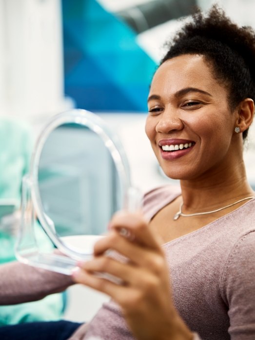 woman smiling during her dental checkup