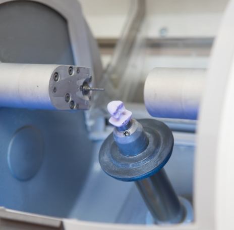 Milling machine creating a same day dental crown