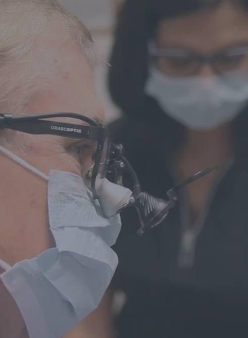 Rock Hill dentist wearing dental binoculars while treating a patient