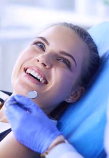 patient smiling in dental chair near India Hook