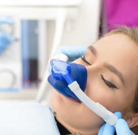 Woman with nitrous oxide sedation dentistry mask