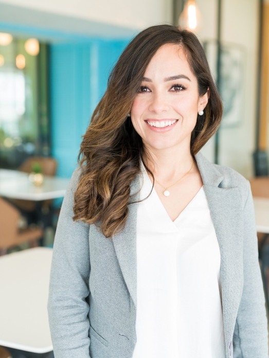 Businesswoman smiling in an office after a smile makeover in Rock Hill