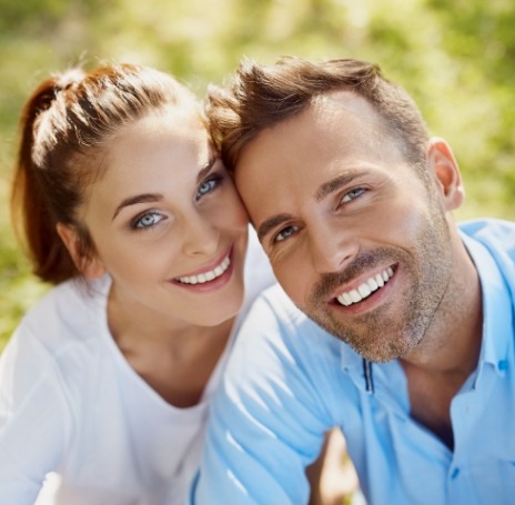 Man and woman smiling together outdoors