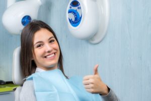 thumbs up from dental patient