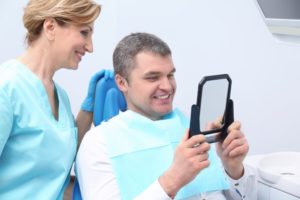 man smiling in dentist chair 