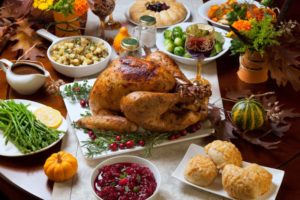 Closeup of table spread with Thanksgiving foods