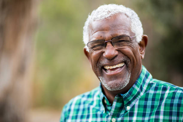 person smiling after having lower denture fixed